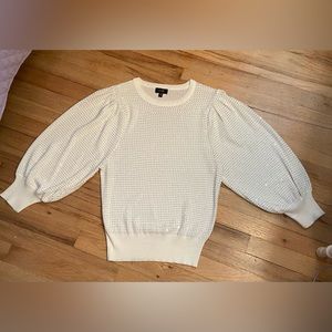 White Sweater with Silver Embellishments.